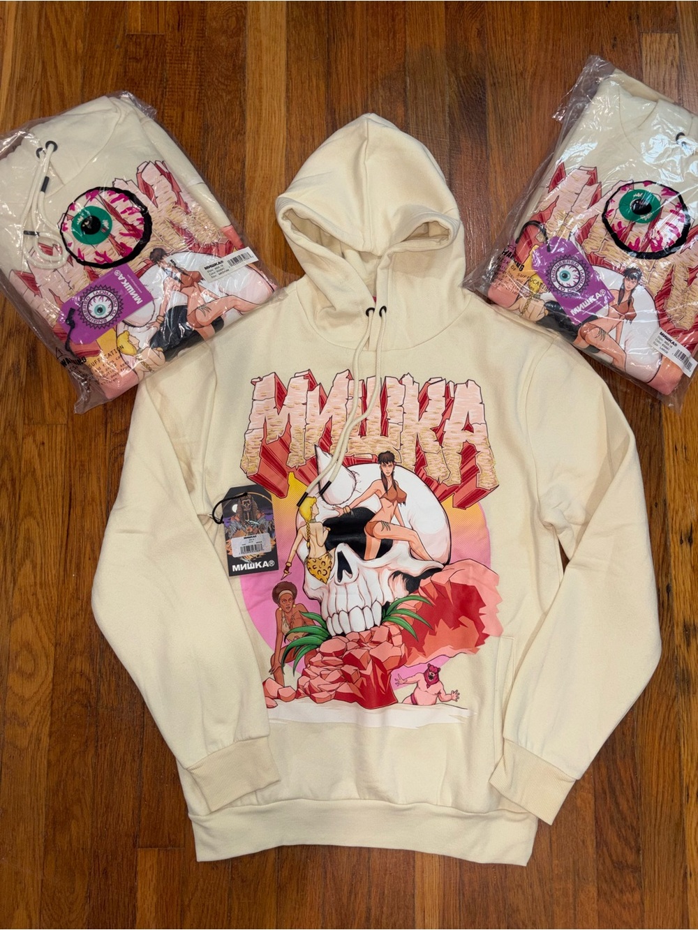 Mishka Cream Hoodie with Tropical Skull Graphic
